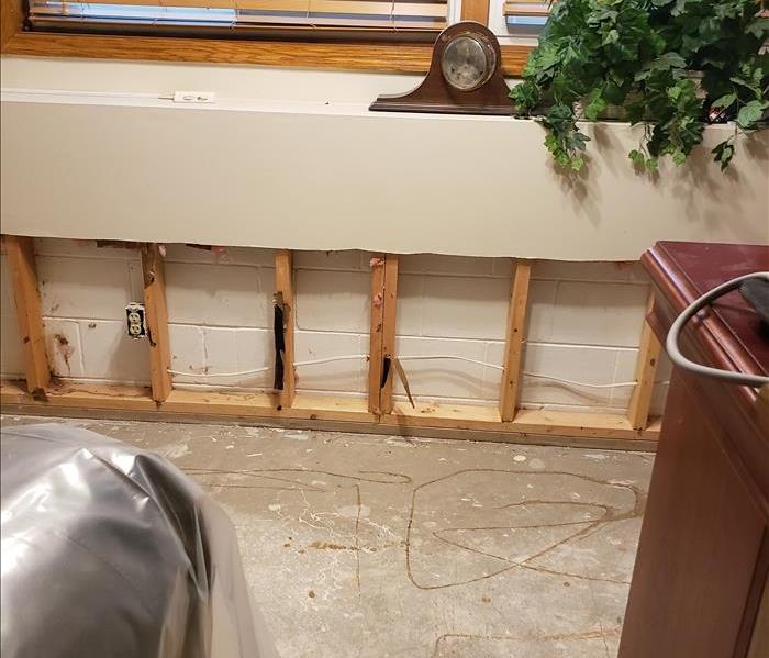 water damage requires floor and drywall removal