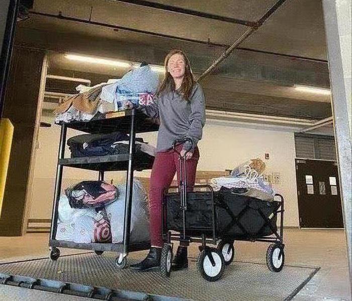 Tierney with clothing on cart