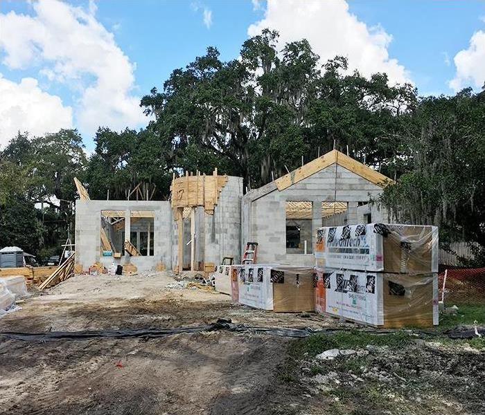 See the power of collaborating with other investors and working together. Image of home under construction.